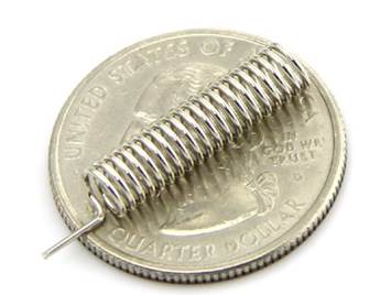 A close-up of a coil on a coin

AI-generated content may be incorrect.